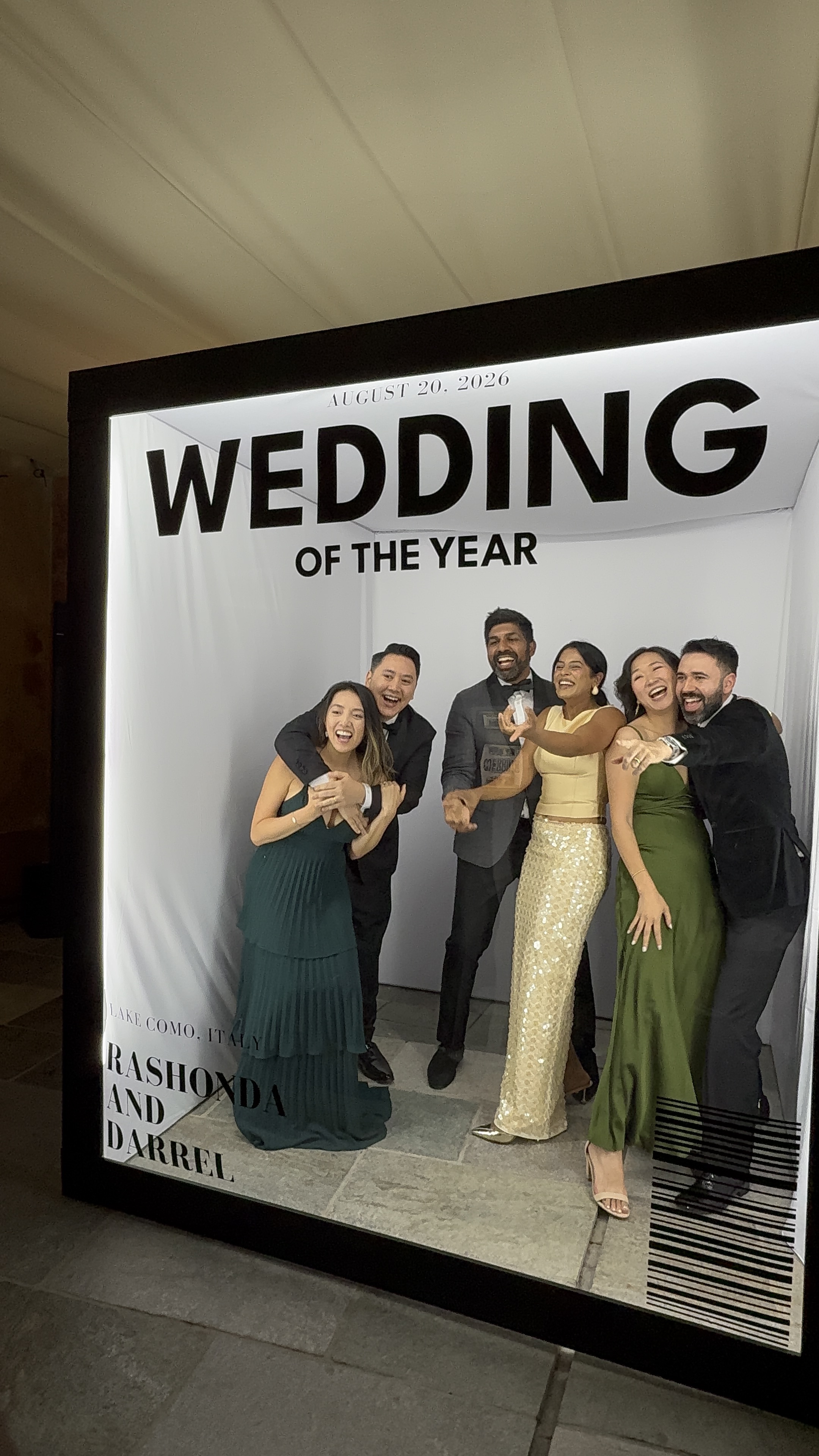 Custom event typography, wedding date, and personalized signage on the illuminated Vogue Booth frame